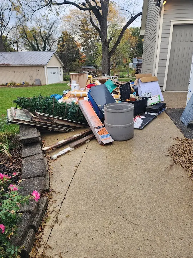 Dumpster being loaded with debris for 10 Yard Dumpster Rental in South El Monte